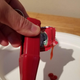 Heinz Packet Roller squeezing ketchup out of a loaded ketchup packet